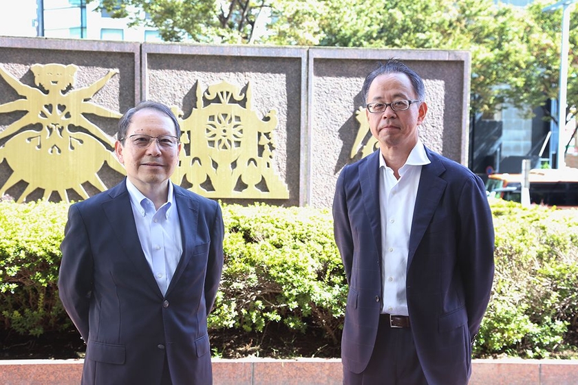 KDDI グローバル技術・運用本部 戸所弘光と黒田浩之